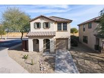 Two-story house with tile roof, driveway, and landscaping at 7905 S 63Rd Dr, Laveen, AZ 85339