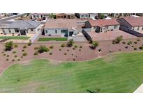 Aerial view of a house with a backyard and surrounding neighborhood at 1417 E Mark Ct, Casa Grande, AZ 85122