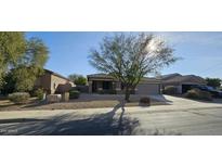 Single-story house with a two-car garage and desert landscaping at 17913 W Desert View Ln, Goodyear, AZ 85338