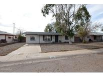 Charming single story home with a well-maintained front yard at 1919 W Fairmount Ave, Phoenix, AZ 85015