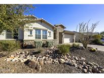 Single-story home with stone accents and landscaped front yard at 30277 N 115Th Ln, Peoria, AZ 85383