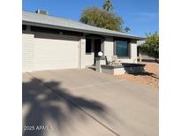 Front view of a single-story home with a carport and landscaped yard at 7950 E Keats Ave # 194, Mesa, AZ 85209
