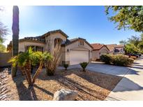 One-story house with desert landscaping and a two-car garage at 3949 E Monona Dr, Phoenix, AZ 85050