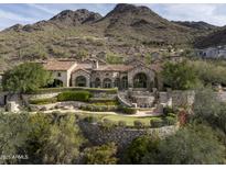 Luxury estate home nestled in the mountains with stunning landscaping and a large pool at 11068 E Canyon Cross Way, Scottsdale, AZ 85255