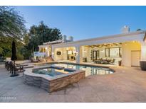 Luxury home with inviting pool, spa, and expansive patio perfect for outdoor entertaining at 5301 E Roadrunner Rd, Paradise Valley, AZ 85253