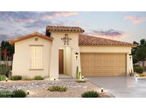 One-story home with tan exterior, brown door, and terracotta tile roof. Landscaped front yard with desert plants at 2221 S 241St Dr, Buckeye, AZ 85326