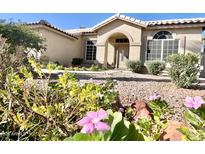 House exterior showcasing a landscaped front yard with flowers at 530 N Jesse Ct, Chandler, AZ 85225
