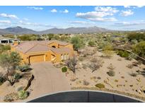 Single-story home with desert landscaping and mountain views at 10432 E Winter Sun Dr, Scottsdale, AZ 85262
