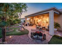 Spacious covered patio with seating and fountain at 13321 W Chapala Ct, Sun City West, AZ 85375