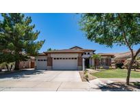 Single-story home with a three-car garage and well-maintained landscaping at 319 W Vinedo Ln, Tempe, AZ 85284