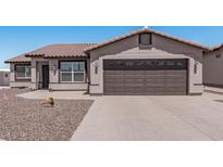 Single-story home with a two-car garage and desert landscaping at 5736 E Lawndale St, Mesa, AZ 85215