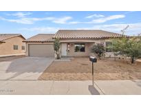 Single-story house with a two-car garage and desert landscaping at 8517 W Campbell Ave, Phoenix, AZ 85037