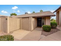 Updated condo exterior with private gated entry and well-manicured landscaping at 17829 N 45Th Ave, Glendale, AZ 85308