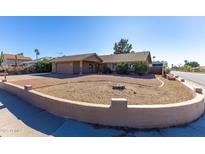 Ranch style home with front yard landscaping and a two-car garage at 3953 W Evans Dr, Phoenix, AZ 85053