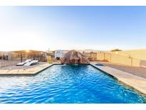 Relaxing pool with waterfall feature at 7214 N 183Rd Ave, Waddell, AZ 85355