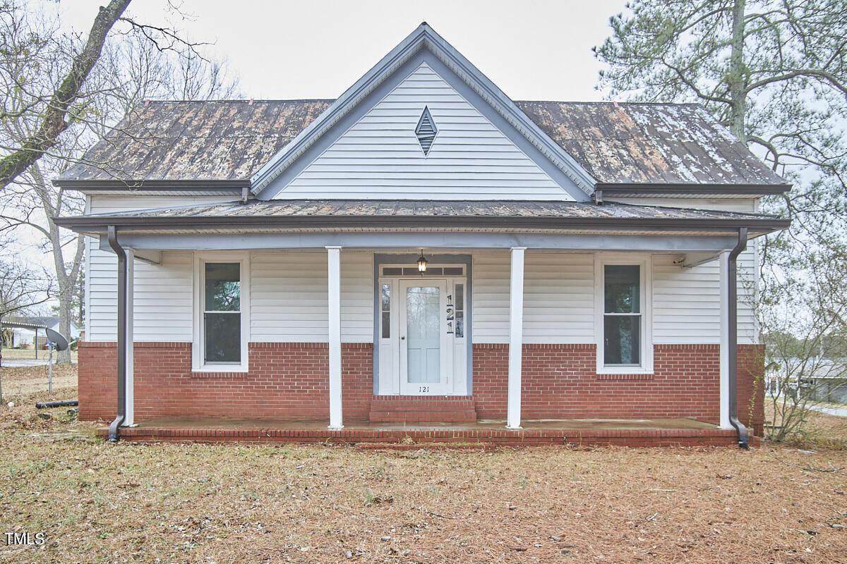 Photo one of 121 W Main St St Coats NC 27521 | MLS 10009720