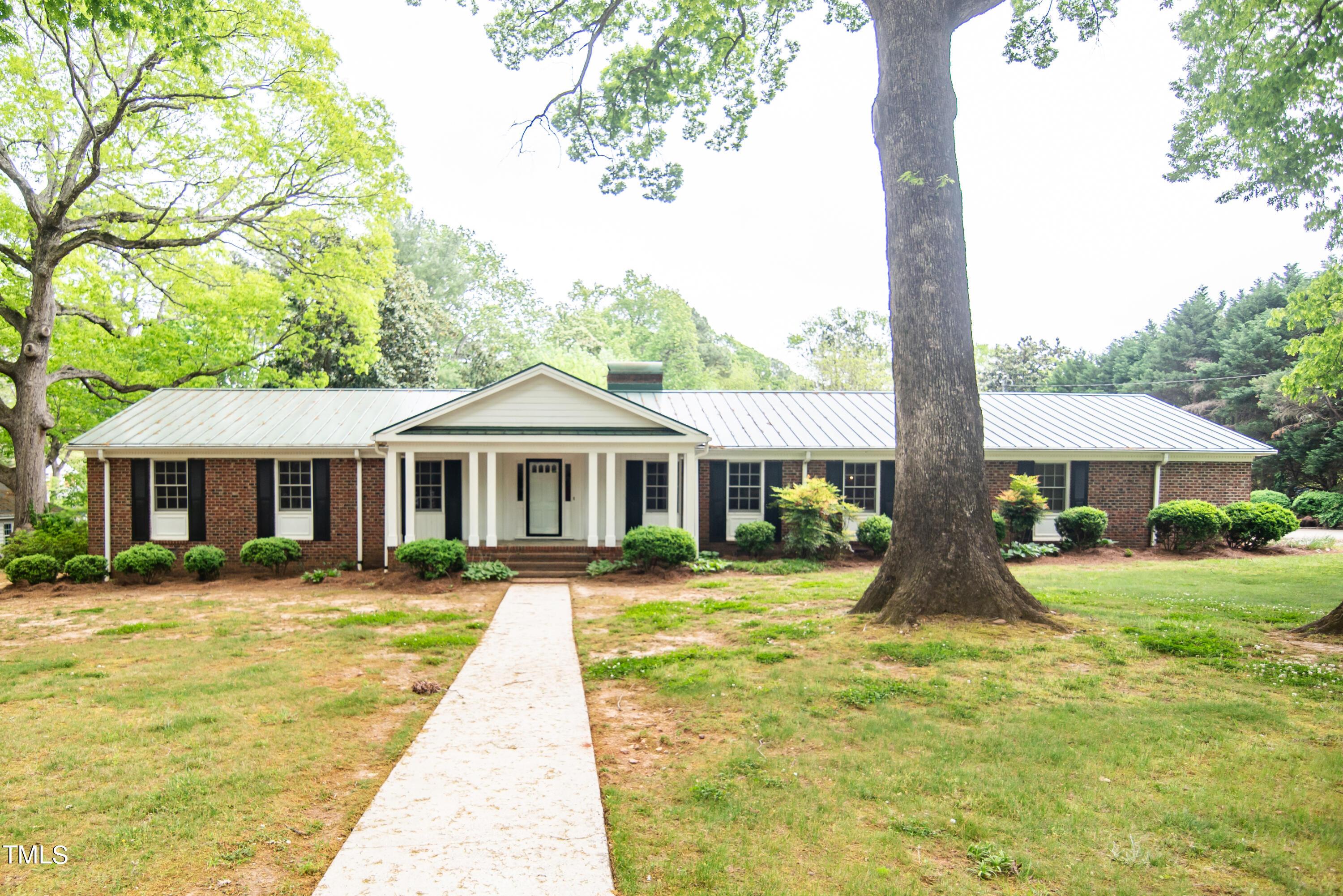 Photo one of 6700 Valley Lake Dr Raleigh NC 27612 | MLS 10024110