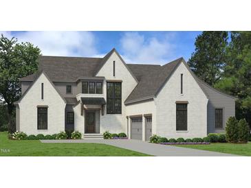 Two-story home with white brick exterior, gray accents, and a three-car garage at 1805 Okeefe Ln # 1D, Raleigh, NC 27613