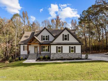 Two-story home with stone accents and a large front yard at 143 Hook Dr # 23, Fuquay Varina, NC 27526