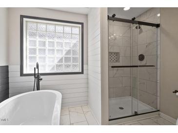 Modern bathroom with soaking tub and glass shower at 607 Dycus Rd, Sanford, NC 27330