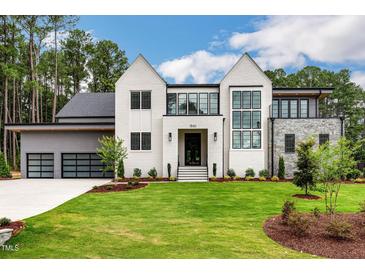 Photo one of 1640 Estate Valley Ln Raleigh NC 27613 | MLS 10014378