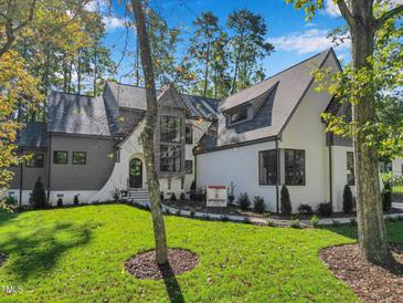 Exterior of a modern house with a gray and white color scheme at 1312 Hunting Ridge Rd, Raleigh, NC 27615