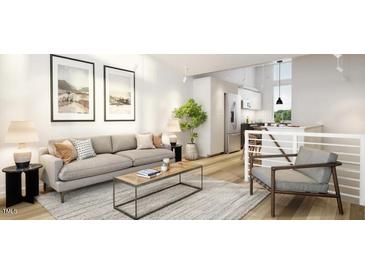 Bright living room features an open floor plan, neutral colors, and a comfortable seating area at 106 Broadway St # 101, Durham, NC 27701