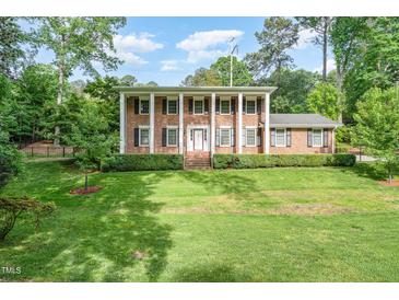 Photo one of 5513 Parkwood Dr Raleigh NC 27612 | MLS 10027429