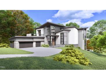 Modern two-story home with attached garage and landscaped yard at 114 Mountaintop Cir, Pittsboro, NC 27312