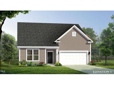 Single-story home with a two-car garage and landscaping at 449 Winding Creek Dr, Lillington, NC 27546