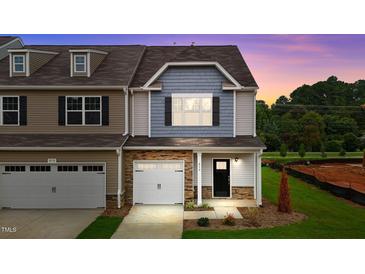 Two-story townhome with two-car garage and landscaped yard at 816 Pryor St # 54, Mebane, NC 27302