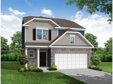 Two-story house with stone accents and a two-car garage at 3500 Mount Ct, Raleigh, NC 27604