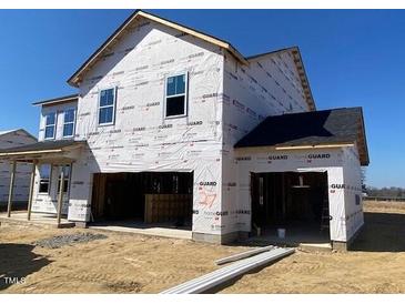 New construction home with wrap around porch and two car garage at 167 Bering Circle # 10, Angier, NC 27501
