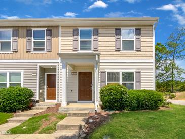 Two-story townhome with brown door and landscaping at 3915 Swinton St, Raleigh, NC 27616