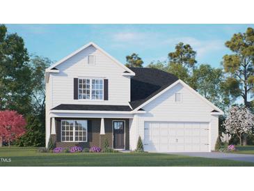Two story home with white siding, a dark brown brick base, and a two car garage at 401 Shorthorn Dr, Wake Forest, NC 27587
