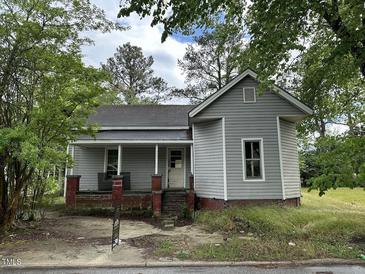Gray house with red brick foundation and porch at 529 Dexter St, Rocky Mount, NC 27803