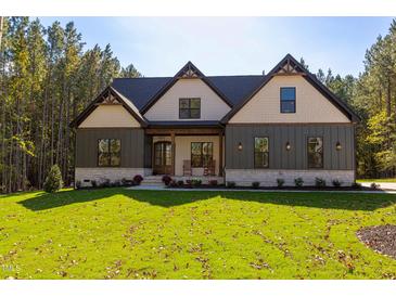 Two-story craftsman style home with a welcoming front porch at 40 Harvest View Way, Franklinton, NC 27525