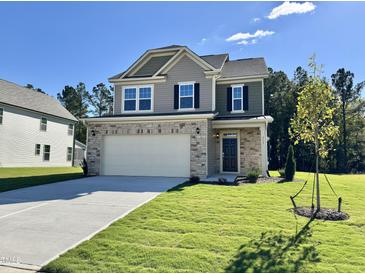 Two story house with stone and siding accents at 313 Winding Creek Dr # 71, Lillington, NC 27546