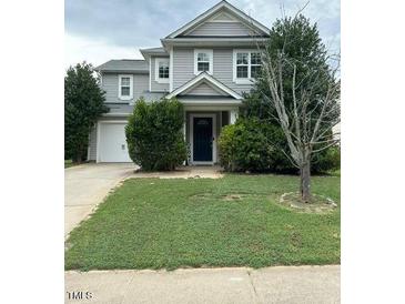 Two-story home with gray siding and landscaping at 506 Averasboro Dr, Clayton, NC 27520