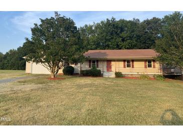 Ranch home with attached garage and porch at 7622 Lindley Mill Rd, Graham, NC 27253