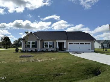 Charming one-story home with two-car garage and landscaped yard at 31 Grace Ridge Ct, Benson, NC 27504