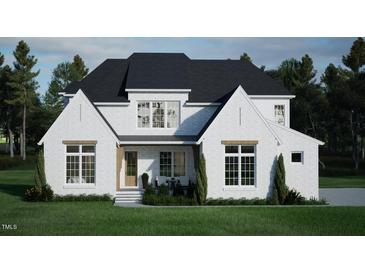 Stunning two-story home with white brick exterior at 5628 Bella Terra Ct, Wake Forest, NC 27587
