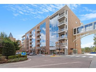 Modern building exterior with glass windows and balconies at 3201 Environ Way # Bldg 3000, Chapel Hill, NC 27517