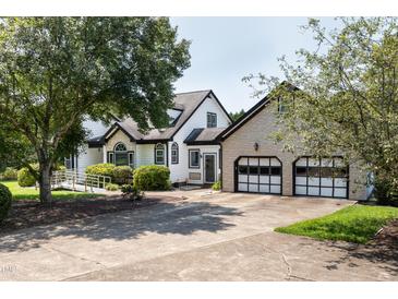 Two-story house with attached two-car garage at 2517 Oakes Plantation Dr, Raleigh, NC 27610