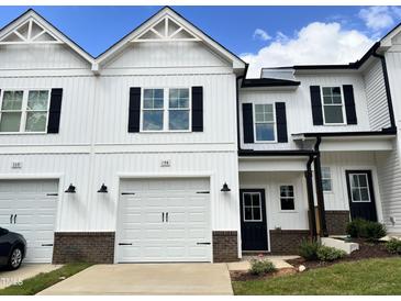 Two-story home with white siding and black accents at 156 S Mistflower St, Clayton, NC 27520