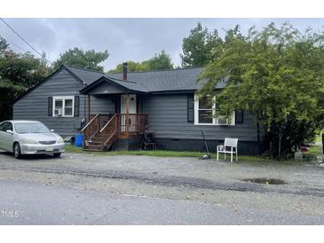 Gray house exterior with a small front porch and yard at 321 Blalock St, Holly Springs, NC 27540