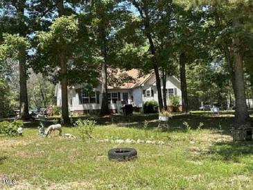 Ranch home with mature trees and a spacious yard at 1060 Saint Paul Church Rd, Roxboro, NC 27574