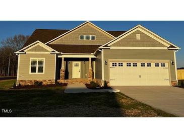 Newly constructed home with two-car garage and attractive landscaping at 952 Olive Branch Dr, Smithfield, NC 27577