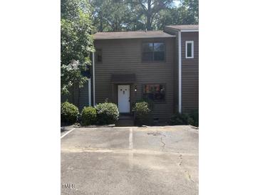 Brown two-story townhouse with front yard and parking at 2146 Charles St # 9, Durham, NC 27707