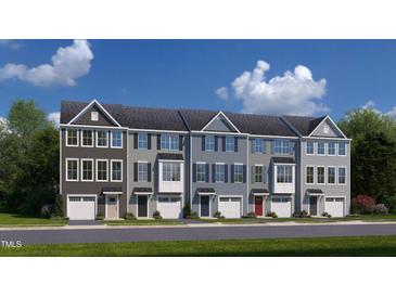 Row of modern townhouses with attached garages at 1218 Helms St, Durham, NC 27713